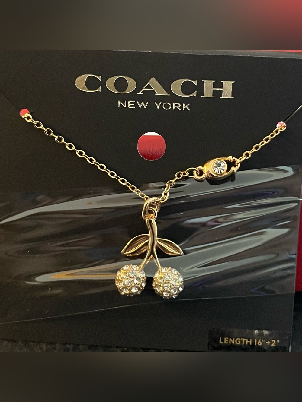 COACH Gold-Tone Crystal Cherry Pendant Necklace with Silver Accent